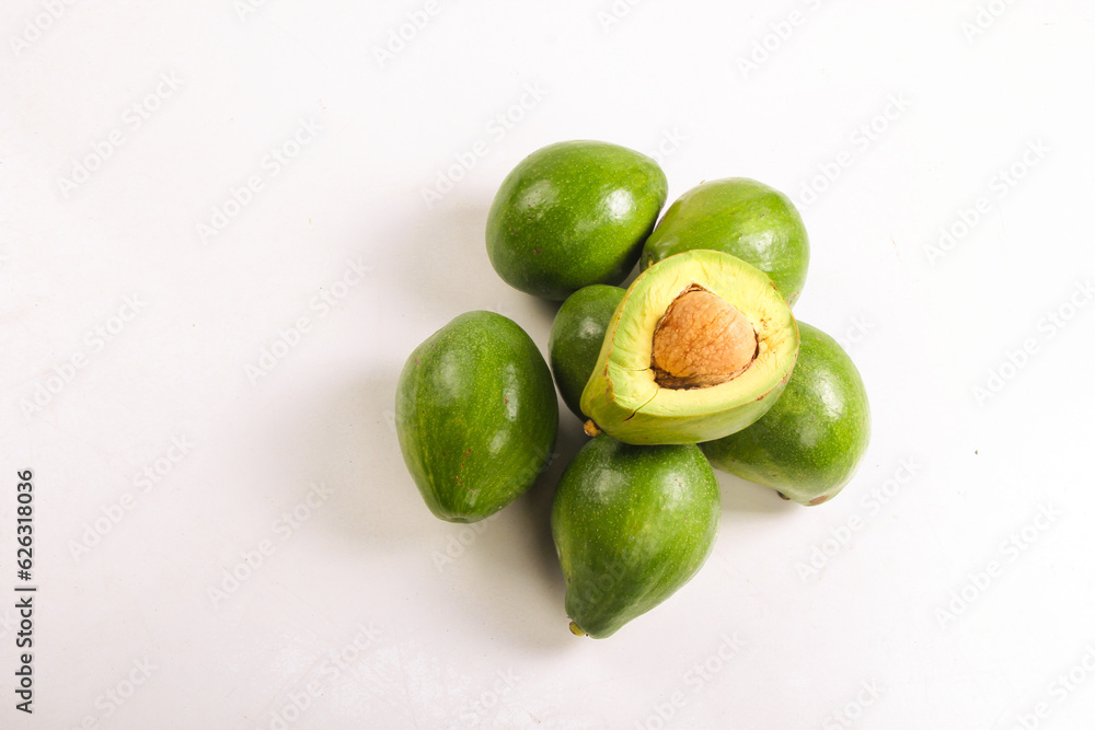 bunch of avocado fruit and split avocado isolated on white, top view bunch of avocado fruit and split avocado isolated on white, top view