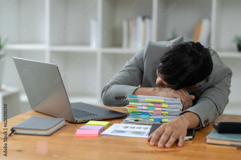 tired business man sleepy and bored from sitting at a desk for a long time and has office syndrome tired business man sleepy and bored from sitting at a desk for a long time and has office syndrome