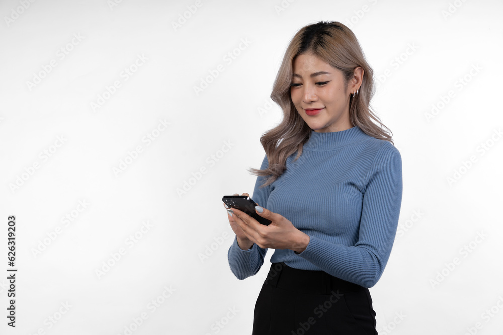 Portrait of confident Asian businesswoman Demonstrates motivation to work in business looking happy while using mobile phone to communicate online, isolated on white background.