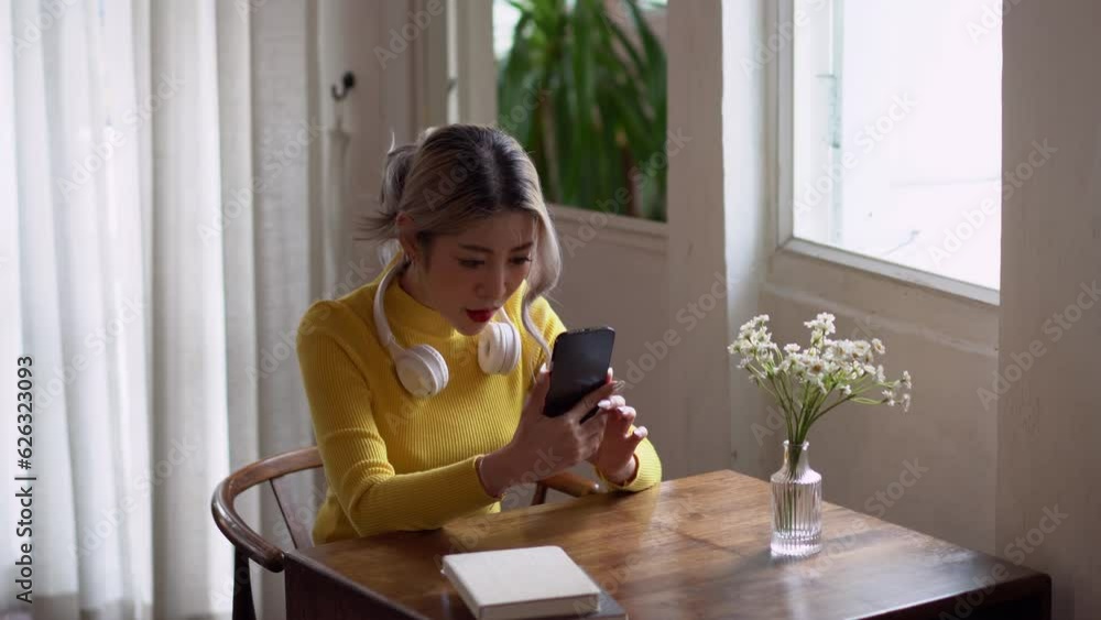 Asian woman happy and cheerful during using smartphone wear casual use mobile phone commuting in the morning. Asian woman happy and cheerful during using smartphone wear casual use mobile phone commuting in the morning.