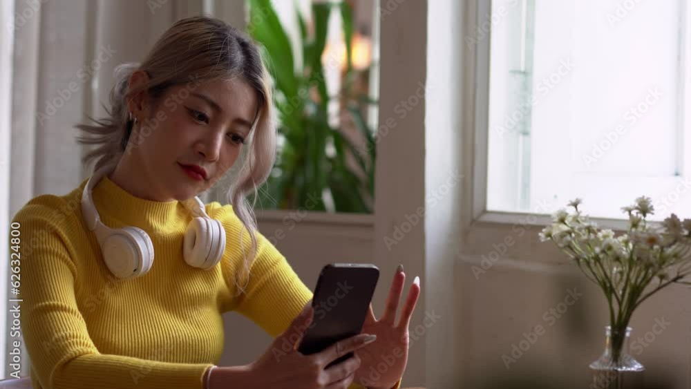 Asian woman happy and cheerful during using smartphone wear casual use mobile phone commuting in the morning. Asian woman happy and cheerful during using smartphone wear casual use mobile phone commuting in the morning.