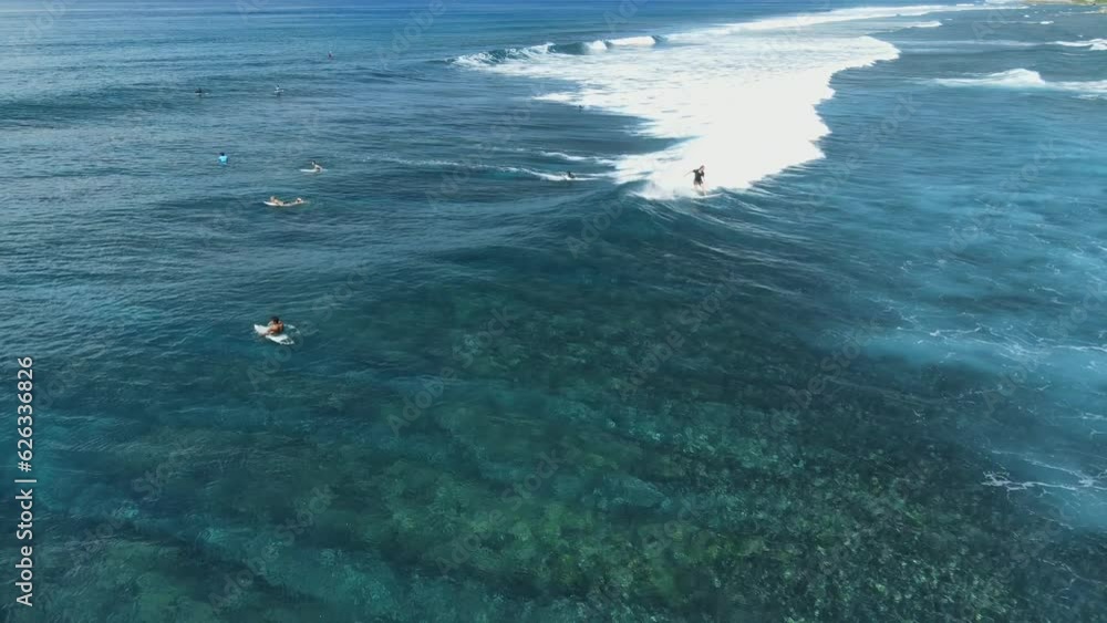 Aerial view with surfers on line up in ocean. Perfect waves with surfers in ocean Aerial view with surfers on line up in ocean. Perfect waves with surfers in ocean