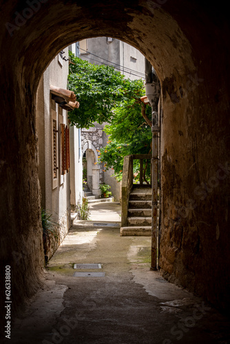 Narrow  pedestrian streets of Brsec  small town on te istrian peninsula coast  rising above the adriatic sea with small stone houses with red clay rooftops