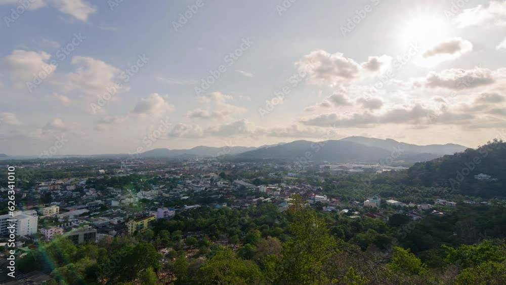 timelapse aerial landscape view of phuket town city skyline with many buildings housing in the central business district with background of bay area and seascape ocean in daytime. timelapse aerial landscape view of phuket town city skyline with many buildings housing in the central business district with background of bay area and seascape ocean in daytime.