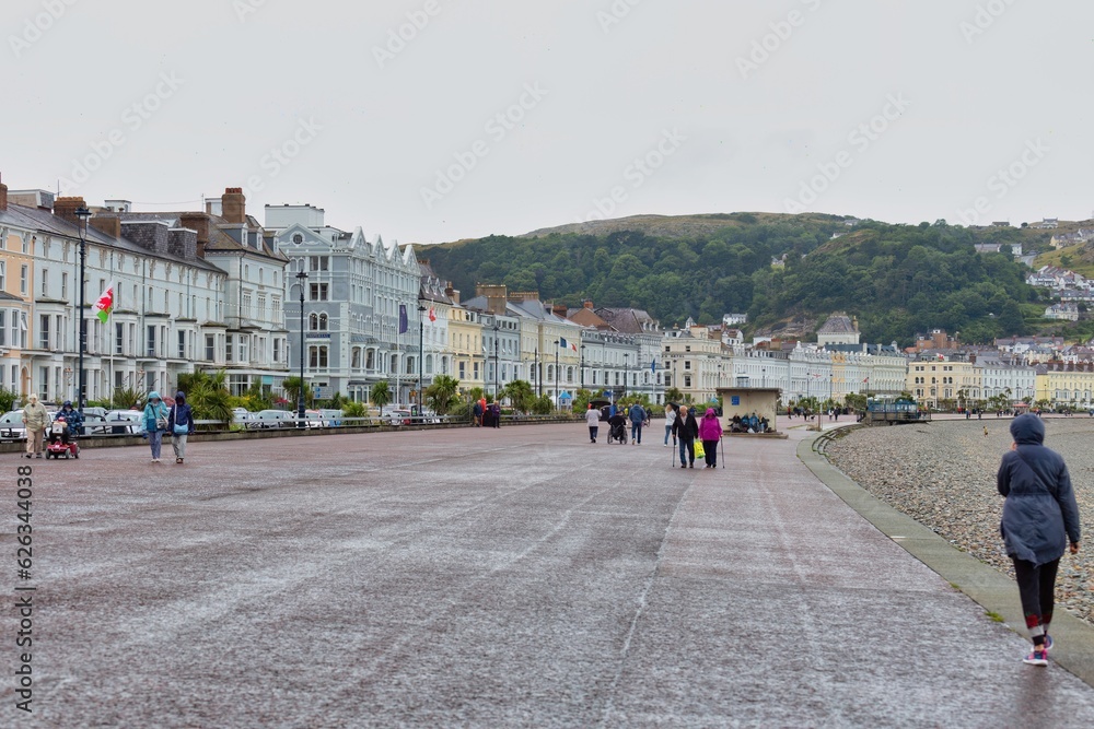 Naklejka premium people walking in the city in Llandudno