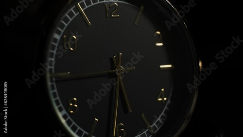 Mechanical watch close-up. Accelerated clock video. arrows move quickly. dark background. Time . The concept of quickly passing time.