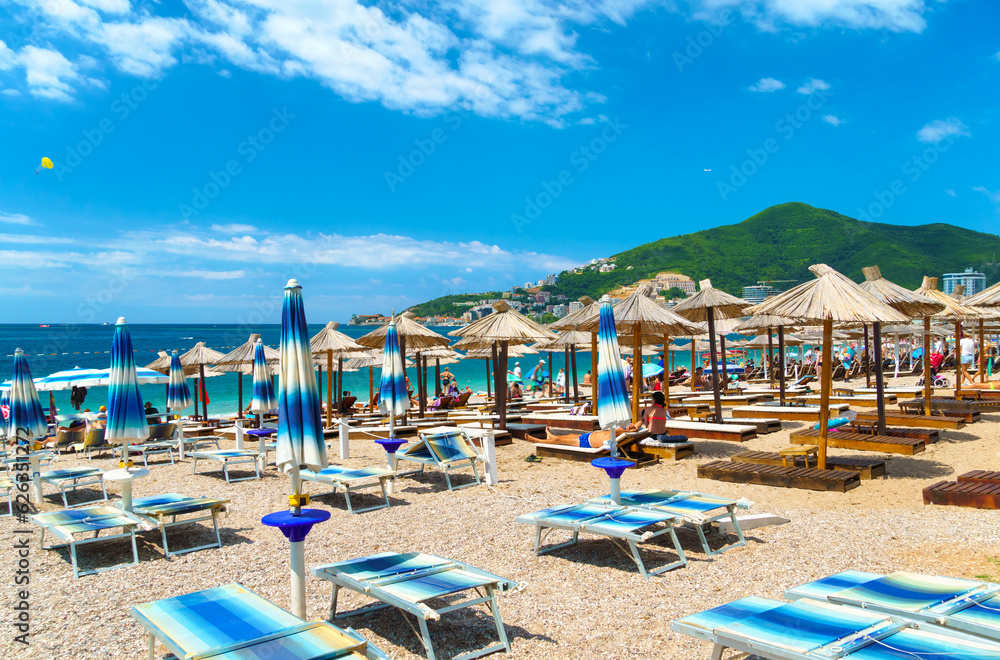beautiful view of the sea beach and resort town, mountains, panorama of Budva in Montenegro, Adriatic Sea, tourism and summer travel