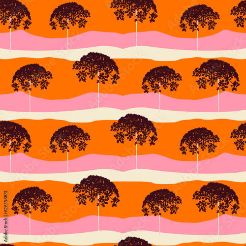 Palm tree in the pink orange mountain sunset