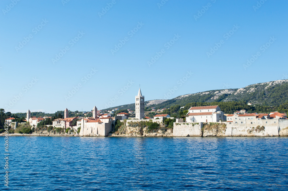 Historic architecture in Rab town, Croatia, with four church towers, waterfront