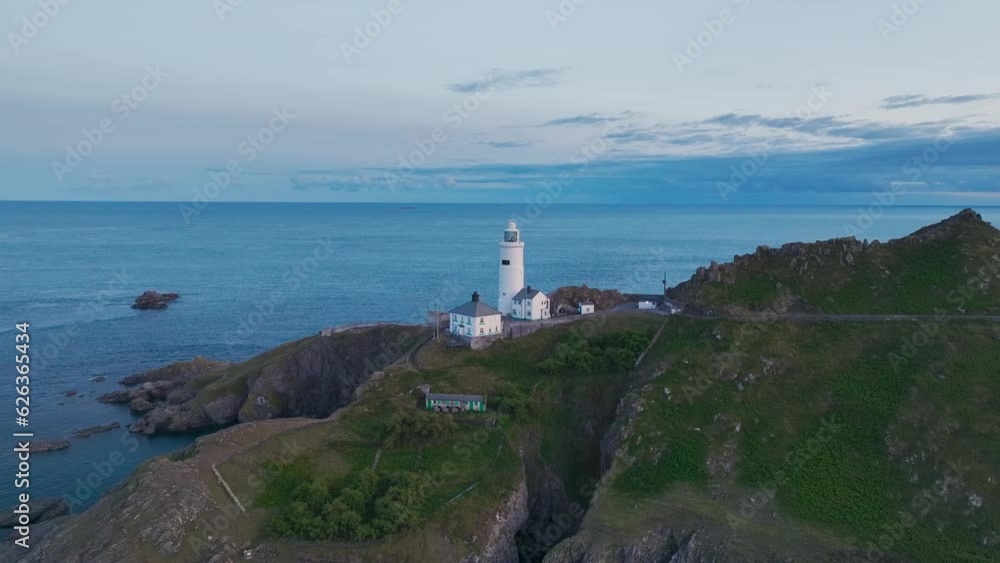 Sunset over Start Point Lighthouse from a drone, Trinity House and South West Coast Path, Devon, England Sunset over Start Point Lighthouse from a drone, Trinity House and South West Coast Path, Devon, England