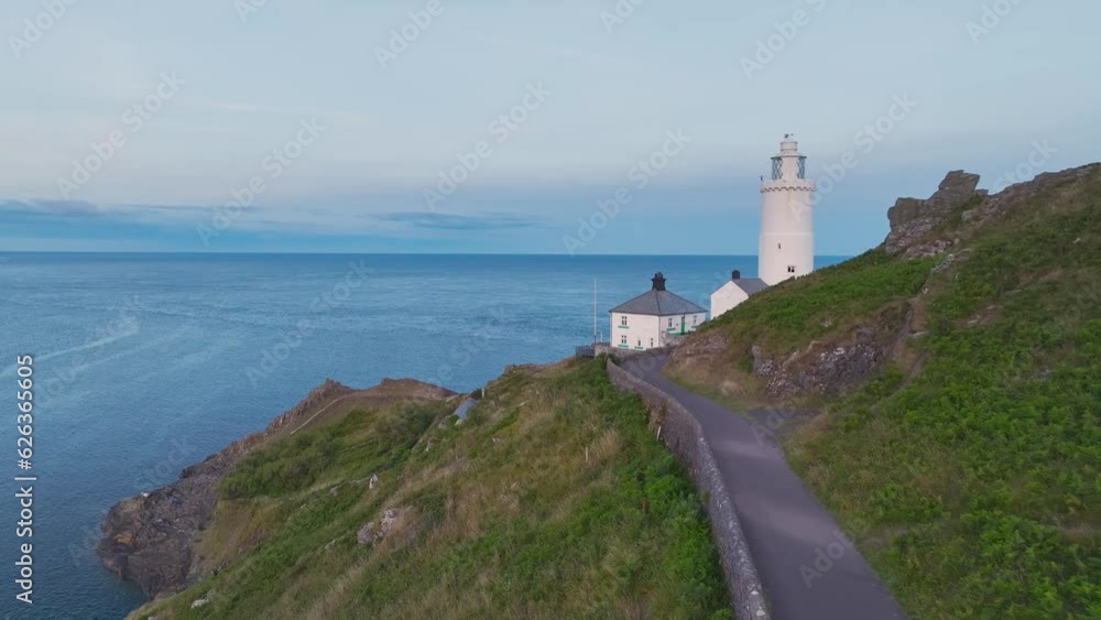 Sunset over Start Point Lighthouse from a drone, Trinity House and South West Coast Path, Devon, England Sunset over Start Point Lighthouse from a drone, Trinity House and South West Coast Path, Devon, England