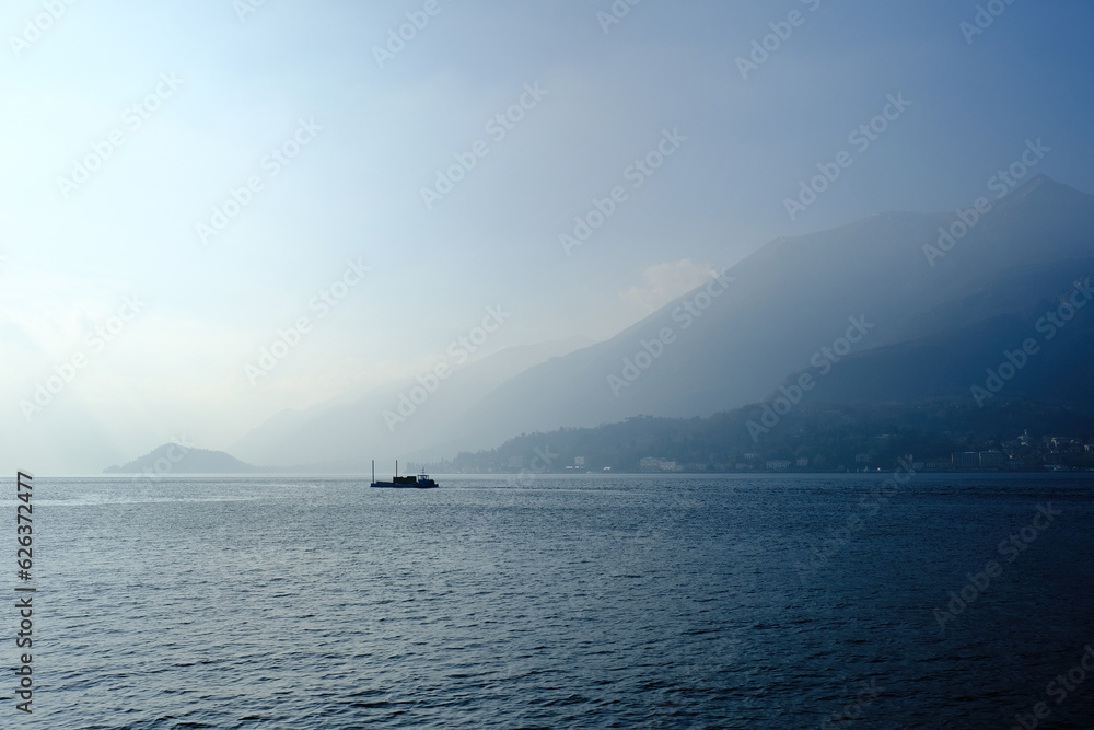Peaceful blue landscape with Como Lake and alps mountains  seen from Bellagio, Lombardy, Italy