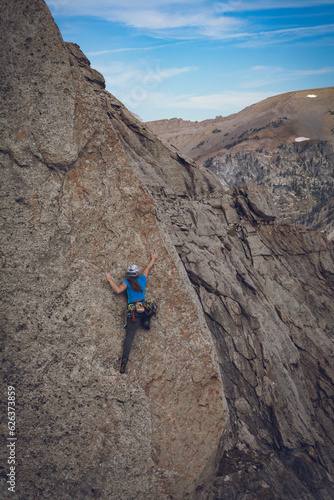 Female rock climber in the mountains