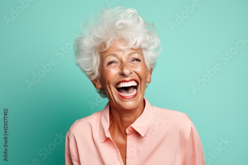 Fictional old lady laughing candidly. Isolated on a colored background. Generative AI.