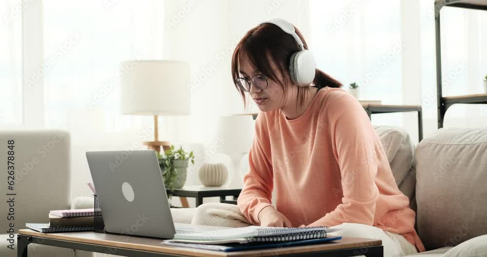 A joyful teenage girl enthusiastically communicates through a video call. Her face is lit up with a bright smile, and her eyes sparkle with happiness as she engages in conversation. A joyful teenage girl enthusiastically communicates through a video call. Her face is lit up with a bright smile, and her eyes sparkle with happiness as she engages in conversation.