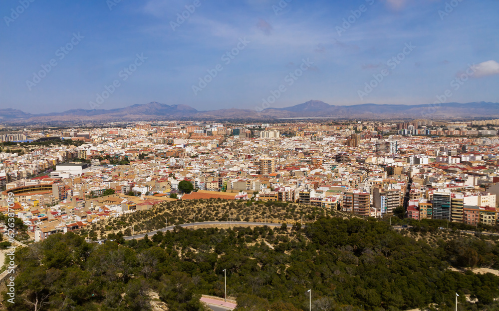 View from the top of the Castle of a sector of the inner city of Alicante and mountains that surround it  