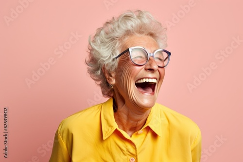 Fictional old lady laughing candidly, isolated on a colored background. Generative AI. © Tuyres