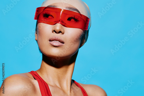 Woman portrait tan smiling emotion sunglasses blue asian studio beauty red fashion