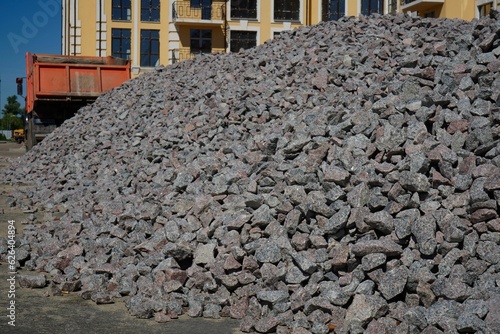 Crushed stone mounds.Grey crushed stones in close up,Versatile building material for horticulture,landscape gardening or road construction,Material for railroad construction.