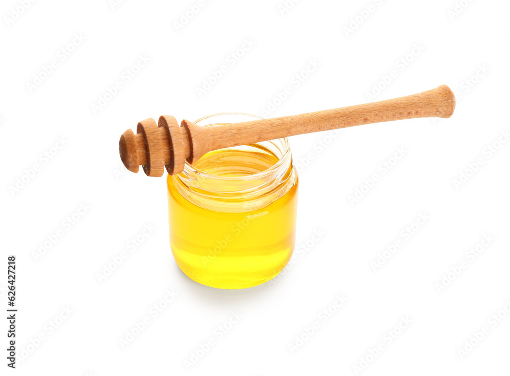 Jar of sweet honey and dipper on white background Jar of sweet honey and dipper on white background