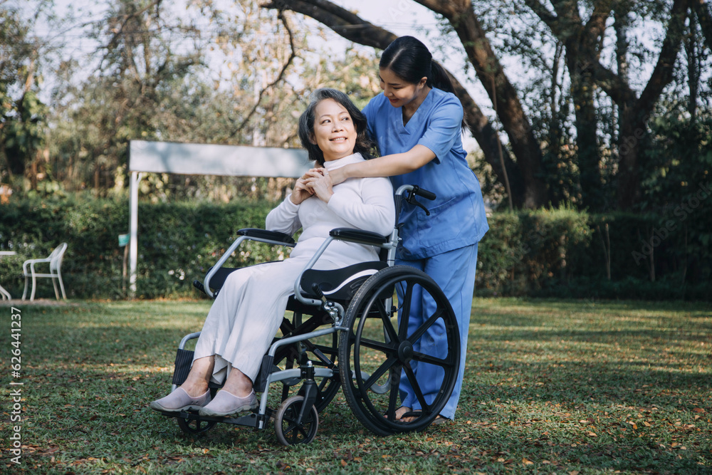 young asian physical therapist working with senior woman on walking with a walker young asian physical therapist working with senior woman on walking with a walker
