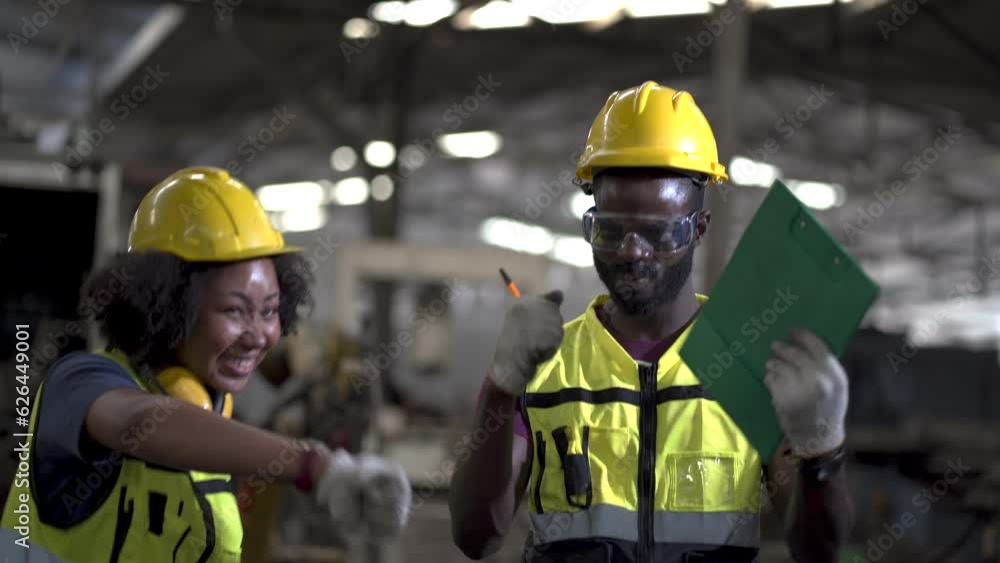 group of African American worker engineers man and woman excited and celebration to work done success together raised hand up to yes in Manufacturing Factory.happy jump to dancing after work finish group of African American worker engineers man and woman excited and celebration to work done success together raised hand up to yes in Manufacturing Factory.happy jump to dancing after work finish