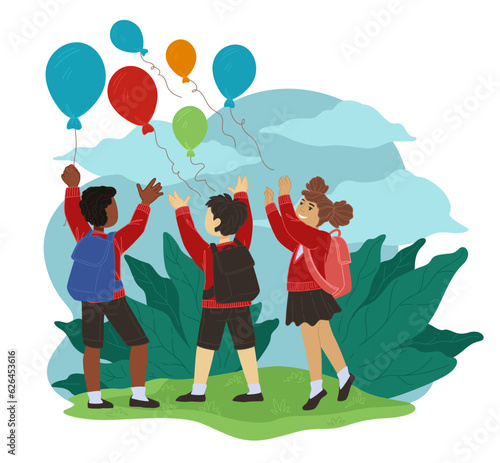 Children playing at school yard throwing balloon