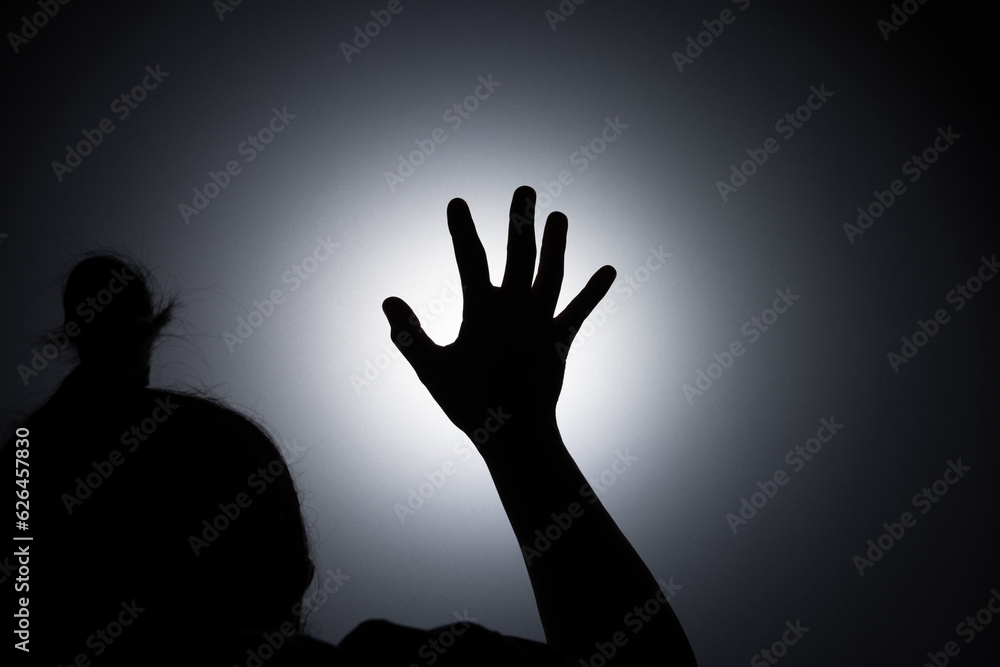 Silhouette photo, A young woman prayed for God's blessings with the power and holiness of God on white background. God and Spiritual Concepts. Silhouette photo, A young woman prayed for God's blessings with the power and holiness of God on white background. God and Spiritual Concepts.
