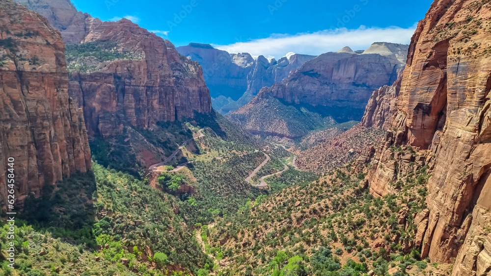 Panoramic aerial view from Zion National Park Canyon Overlook, Utah, USA. Tranquil atmosphere in wilderness. Uninhabited canyon with majestic rock formations and steep cliffs. Mount Carmel highway Panoramic aerial view from Zion National Park Canyon Overlook, Utah, USA. Tranquil atmosphere in wilderness. Uninhabited canyon with majestic rock formations and steep cliffs. Mount Carmel highway