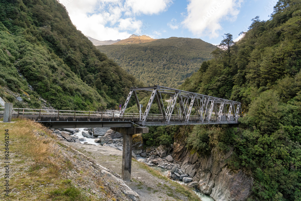 The powerful Haast river flowing the Haast Gates through the mountain Pass The powerful Haast river flowing the Haast Gates through the mountain Pass