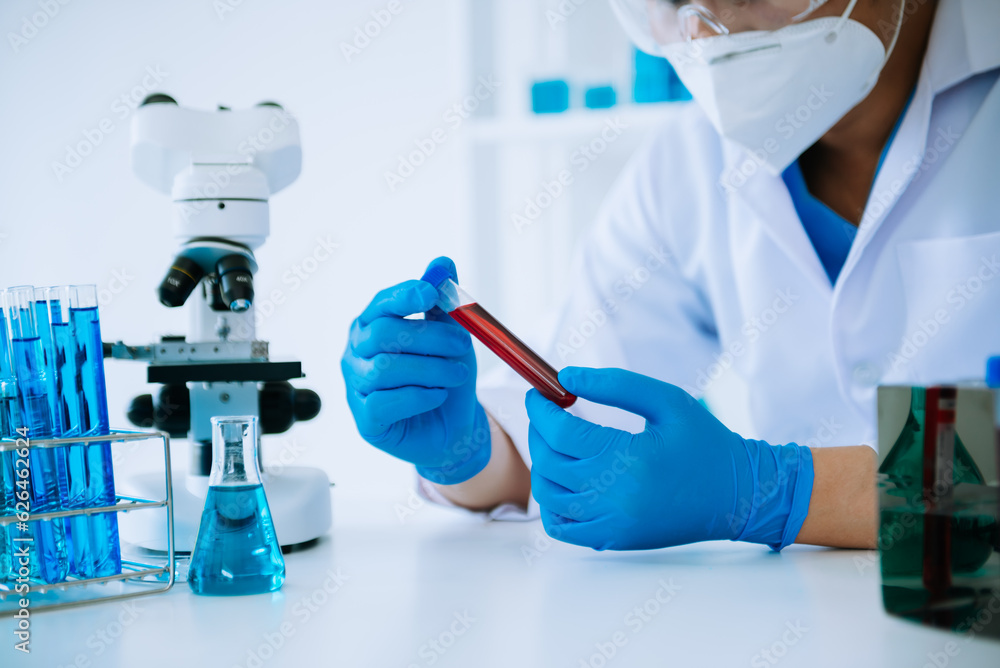 Scientist mixing chemical liquids in the chemistry lab. Researcher working in the chemical laboratory. Scientist mixing chemical liquids in the chemistry lab. Researcher working in the chemical laboratory.