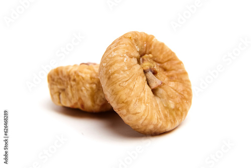 Dried fig fruits isolated on white. Two sweet sundried figs