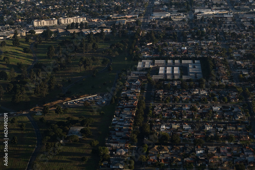 Aerial view over Los Angeles' sprawling, decentralized cityscape. Low-rise construction and single-family homes dominate the landscape.