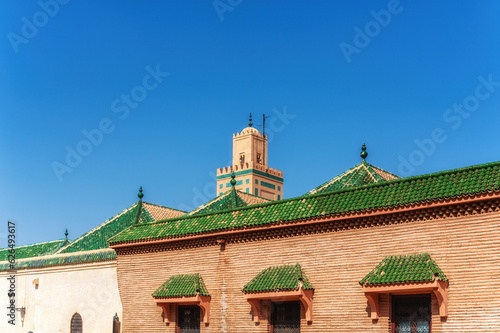 Mosque in Marrakech with a green roof in front