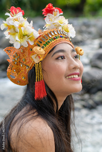 Portrait closeup woman in traditional colororful costume with crown in hair. photo