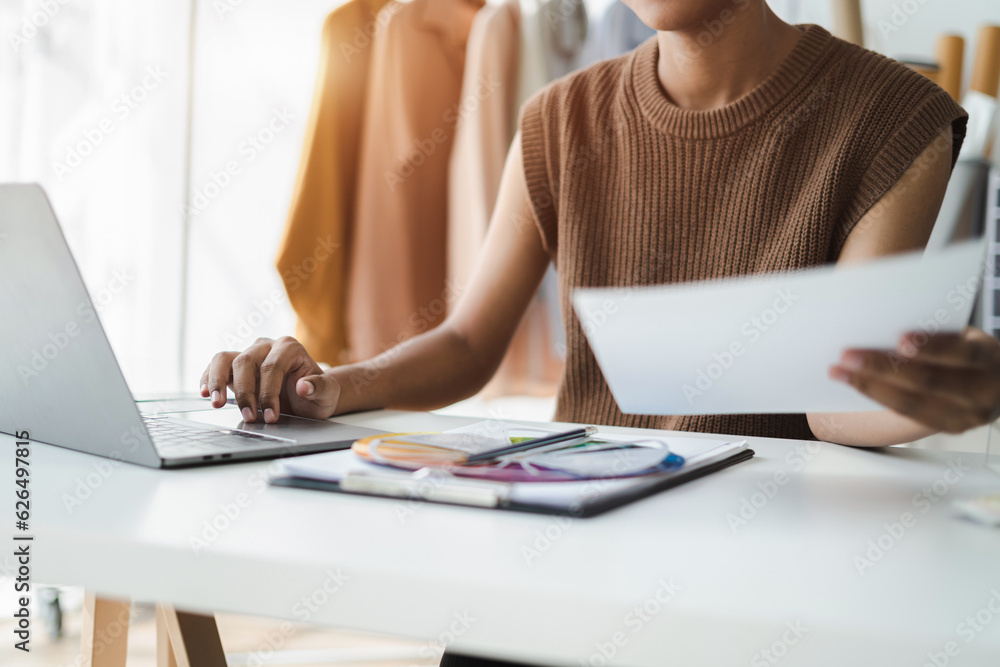 Black woman and small business in e commerce, fashion or logistics in remote startup at home. African American female owner working thinking of the color of clothes. Black woman and small business in e commerce, fashion or logistics in remote startup at home. African American female owner working thinking of the color of clothes.