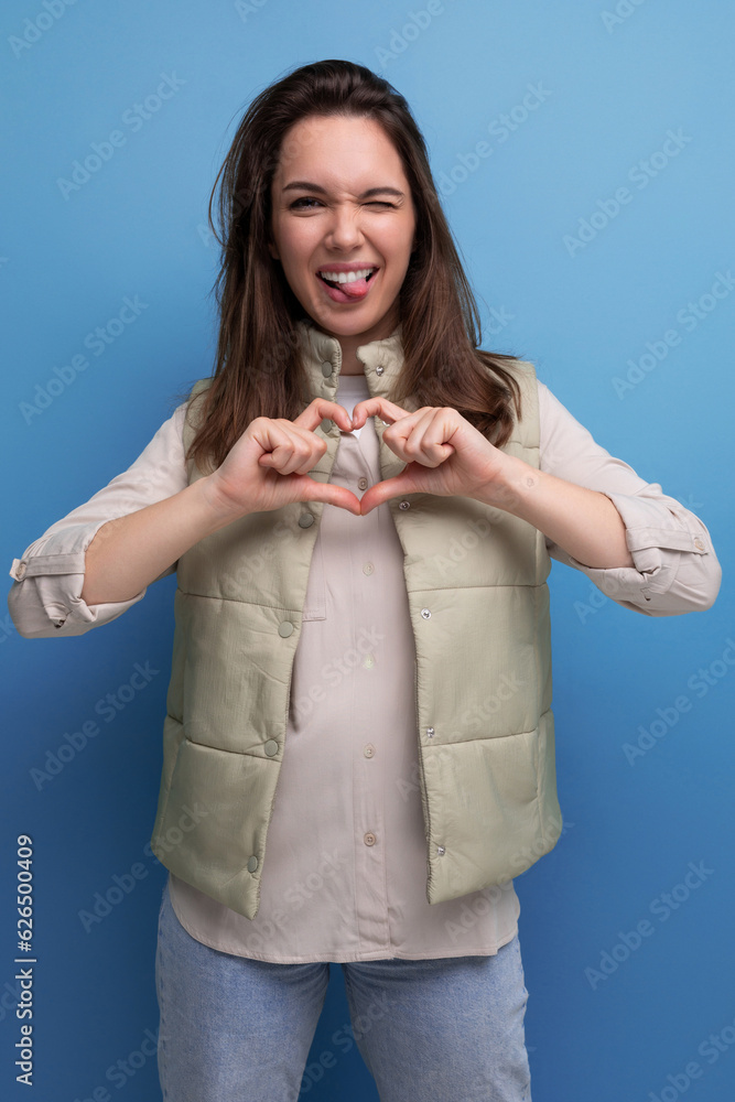positive young brunette lady friendly posing and smiling positive young brunette lady friendly posing and smiling