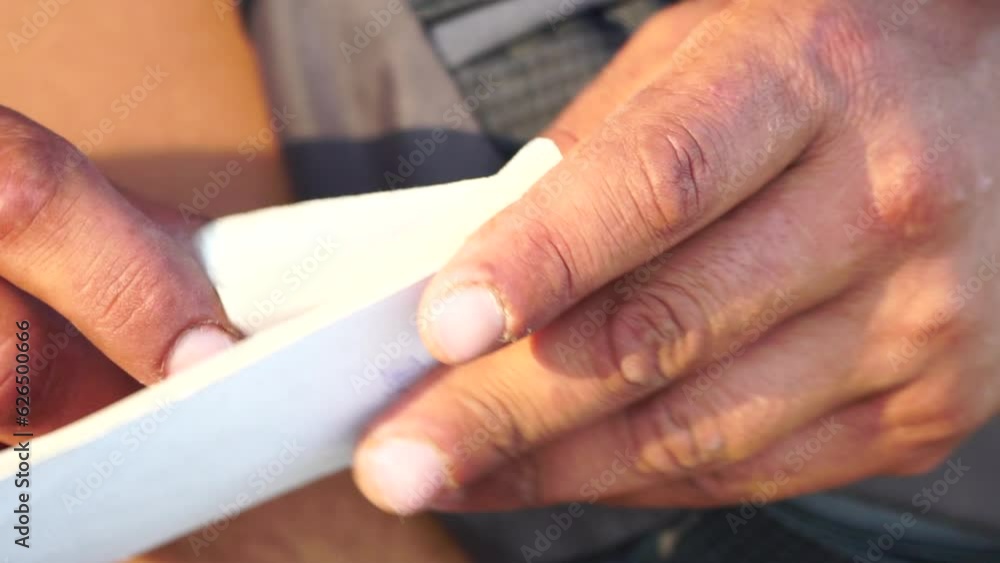 Close-up shot of a man's hands meticulously counting tickets. Slow motion Close-up shot of a man's hands meticulously counting tickets. Slow motion