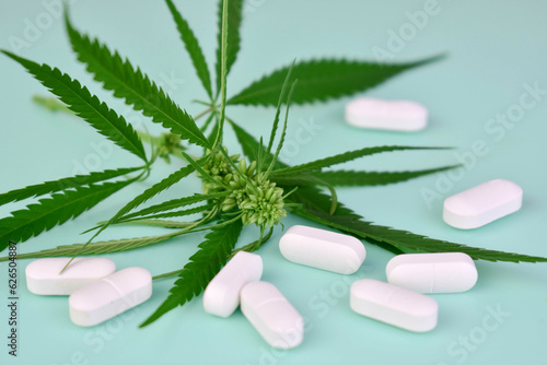 Cannabis tablets and leaves. The concept of drugs based on cannabis.
 photo