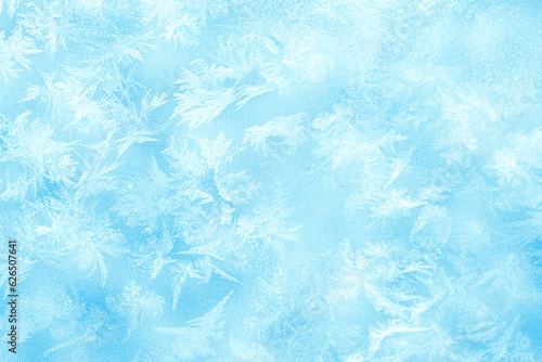 Winter Frost texture iced surface. Textured cold frosty surface of ice. Frost on the glass, freezing effect. Blue ice surface as background for advertising. Ice crystals or cold winter background. 