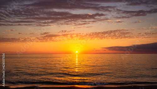 Sunset over sea. Dramatic sunset sky with clouds. Beautiful view of the evening Black Sea.