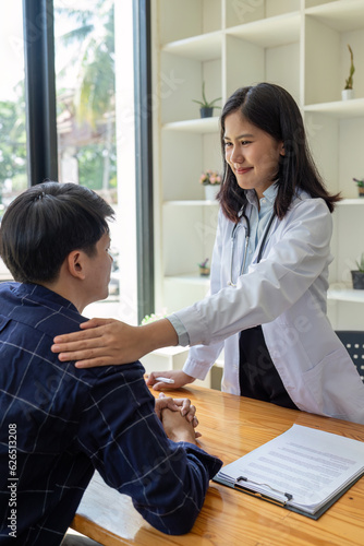 young woman Asian doctor patient, patting shoulder with care, support, sympathy, hope, giving comfort, empathy, asking about health patient