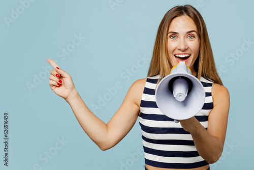 Fotografía Young woman wear striped tank shirt casual clothes hold in hand megaphone scream announces discounts sale Hurry up point aside isolated on plain pastel light blue cyan background