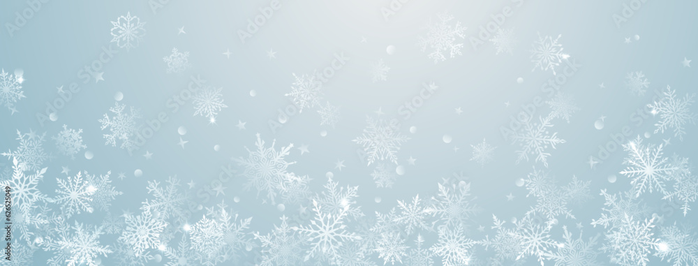 Christmas background of beautiful complex big and small snowflakes in light blue colors. Winter illustration with falling snow