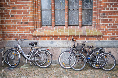 Photography bicycle in front of a brick wall