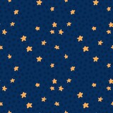 Hand drawn seamless pattern of yellow orange stars on dark blue navy background. Polka dot design of space night print for nursery kids bedding. Cute minimalist sky.