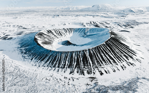 Fotografiet Volcanic crater covered in snow in northern Iceland