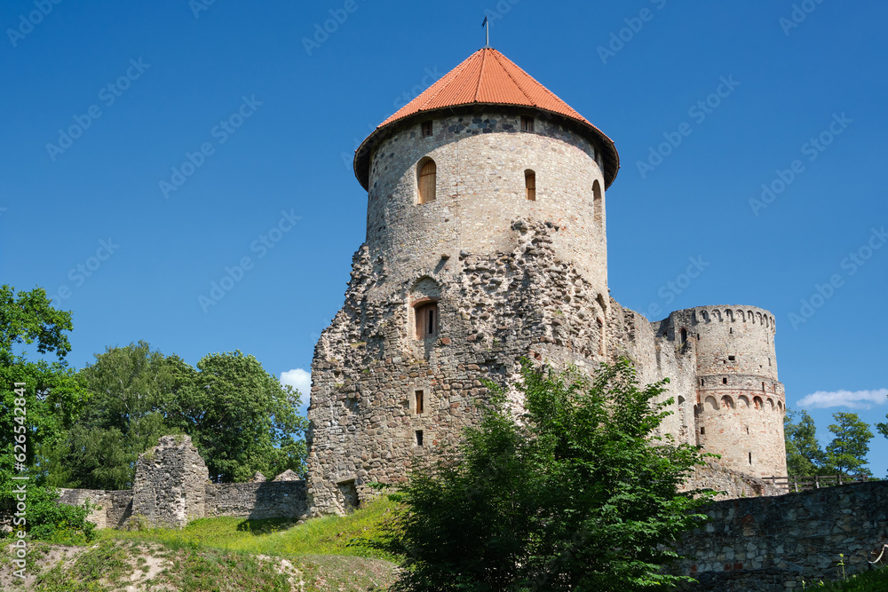 Latvian tourist landmark attraction - Ruins of the medieval Livonian castle, stone walls and towers  in Cesis, Latvia.