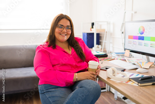 Attractive fat woman working as a graphic designer