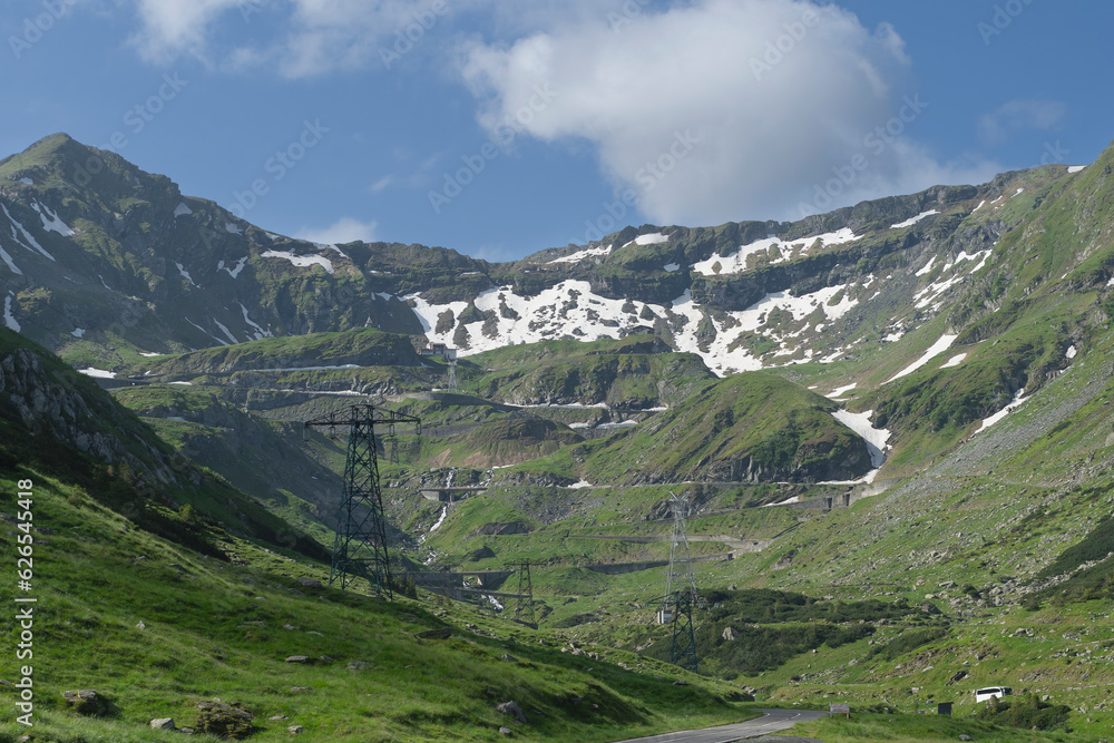 View of Transfăgărășan (trans + Făgăraș) or DN7C view. Transfagarasan road - Ceaușescu's Folly in Carpathian Mountains in Romania. The Transfăgărășan. View of Transfăgărășan (trans + Făgăraș) or DN7C view. Transfagarasan road - Ceaușescu's Folly in Carpathian Mountains in Romania. The Transfăgărășan.